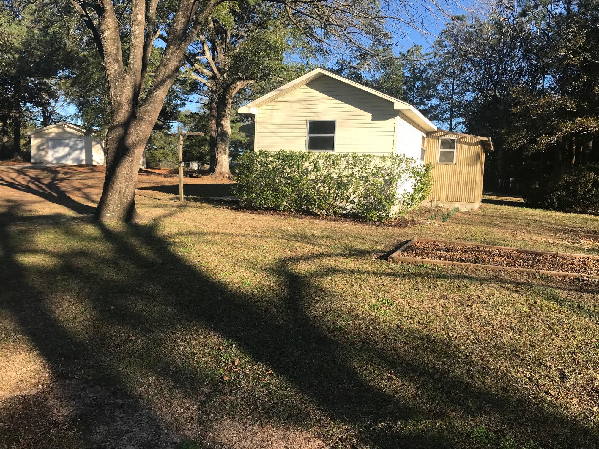 3606 Airport Road Crestview, FL 32539 - Photo 37 of 57 a view of a house with a yard