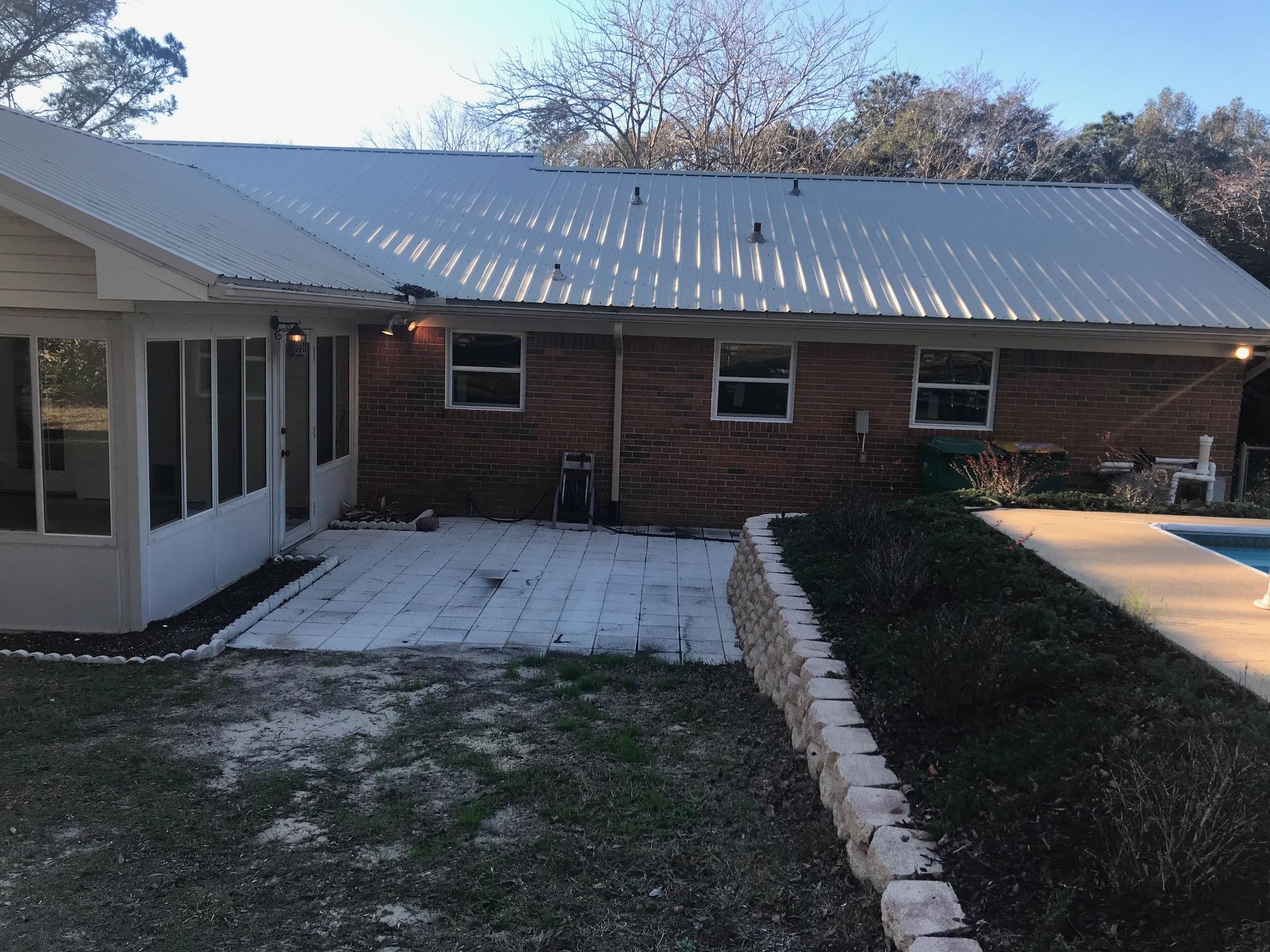3606 Airport Road Crestview, FL 32539 - Photo 41 of 57 a front view of a house with garden