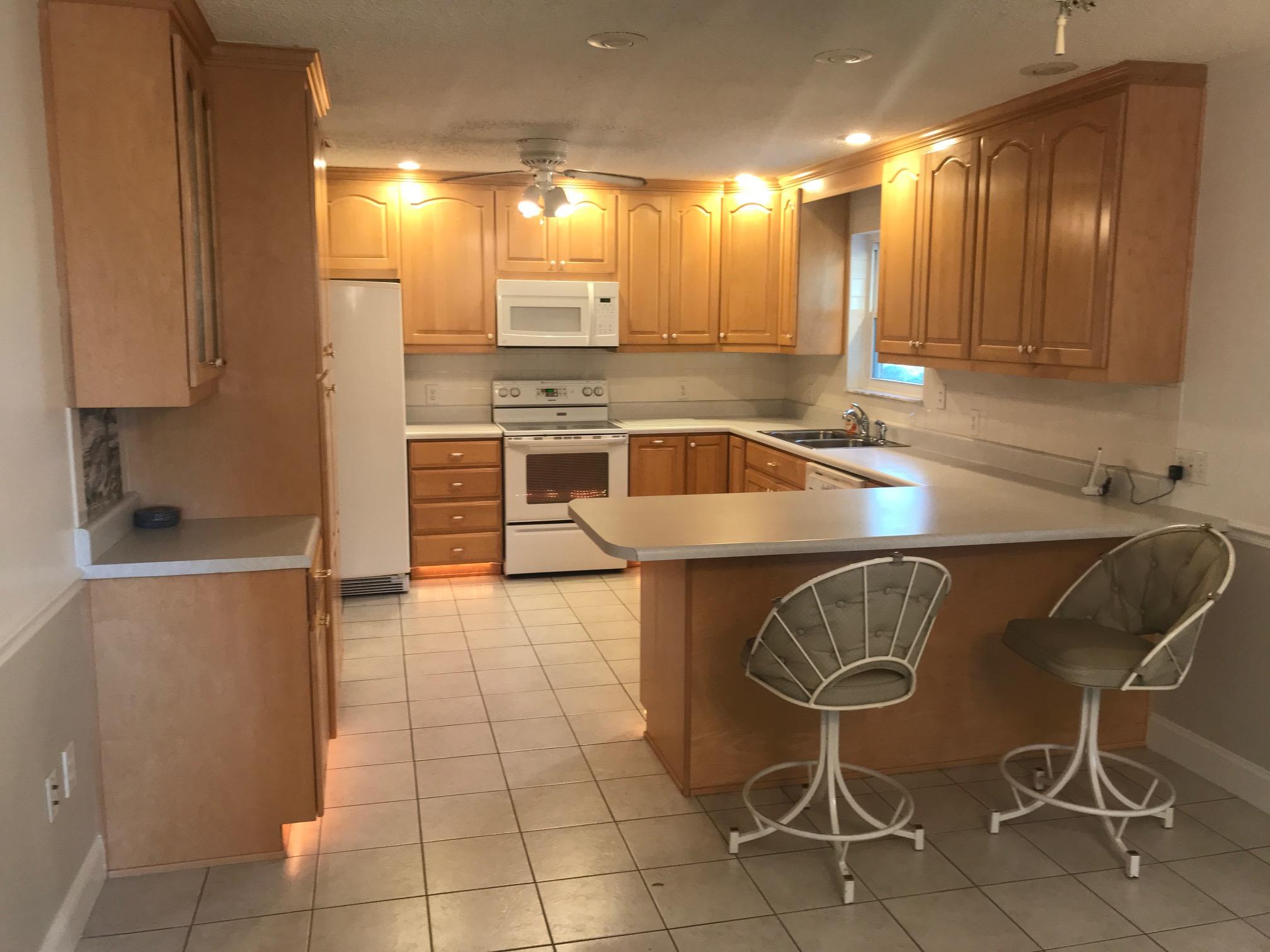 3606 Airport Road Crestview, FL 32539 - Photo 5 of 57 a kitchen with granite countertop a sink and a stove
