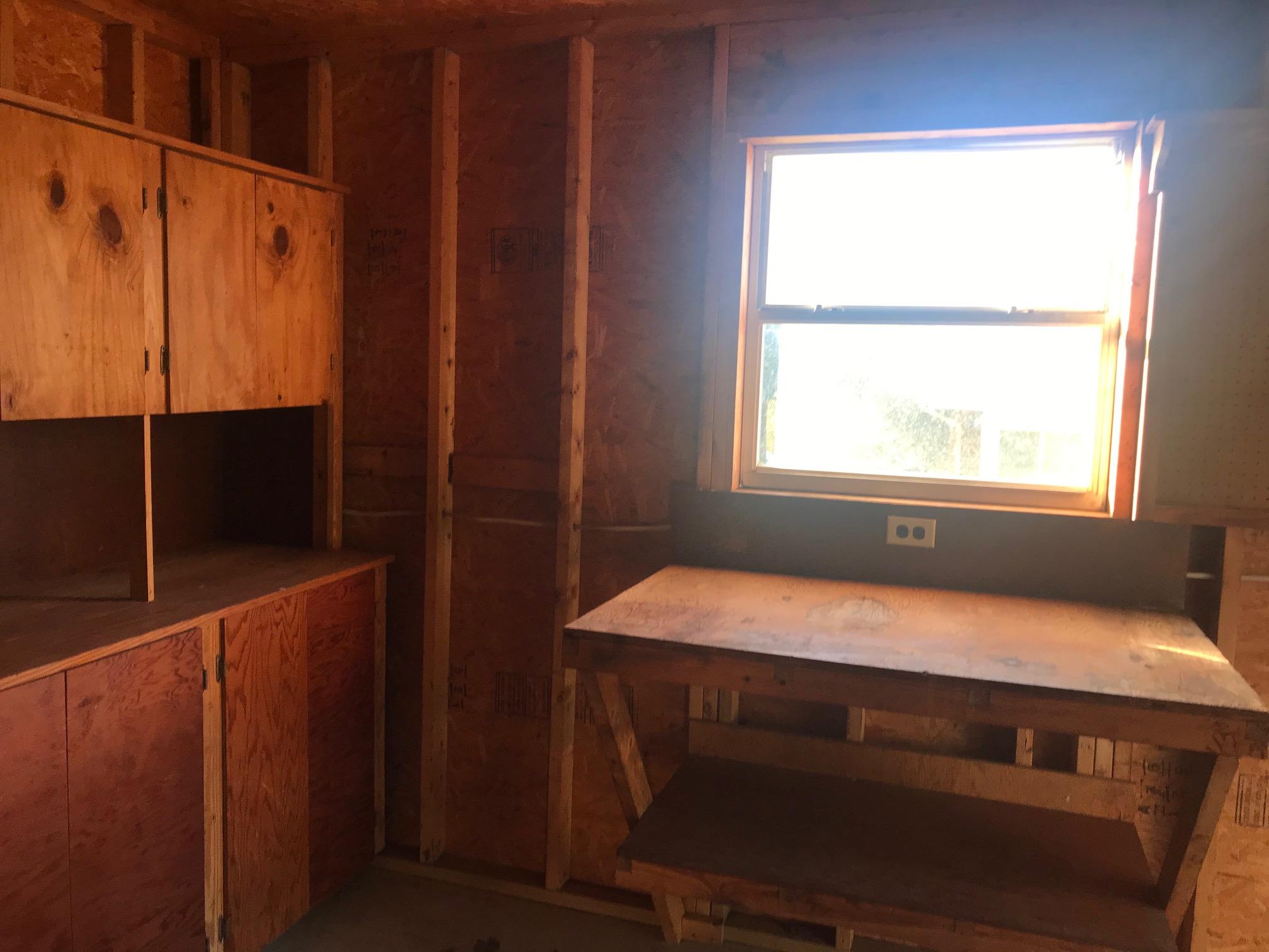3606 Airport Road Crestview, FL 32539 - Photo 54 of 57 a room with wooden floor and a window