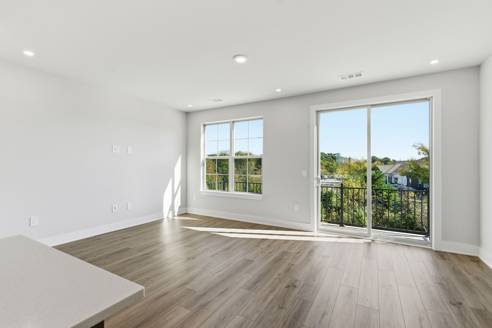 2615 Wilkinson Pike, Unit 1007 Murfreesboro, TN 37129 - Photo 16 of 43 an empty room with wooden floor and windows