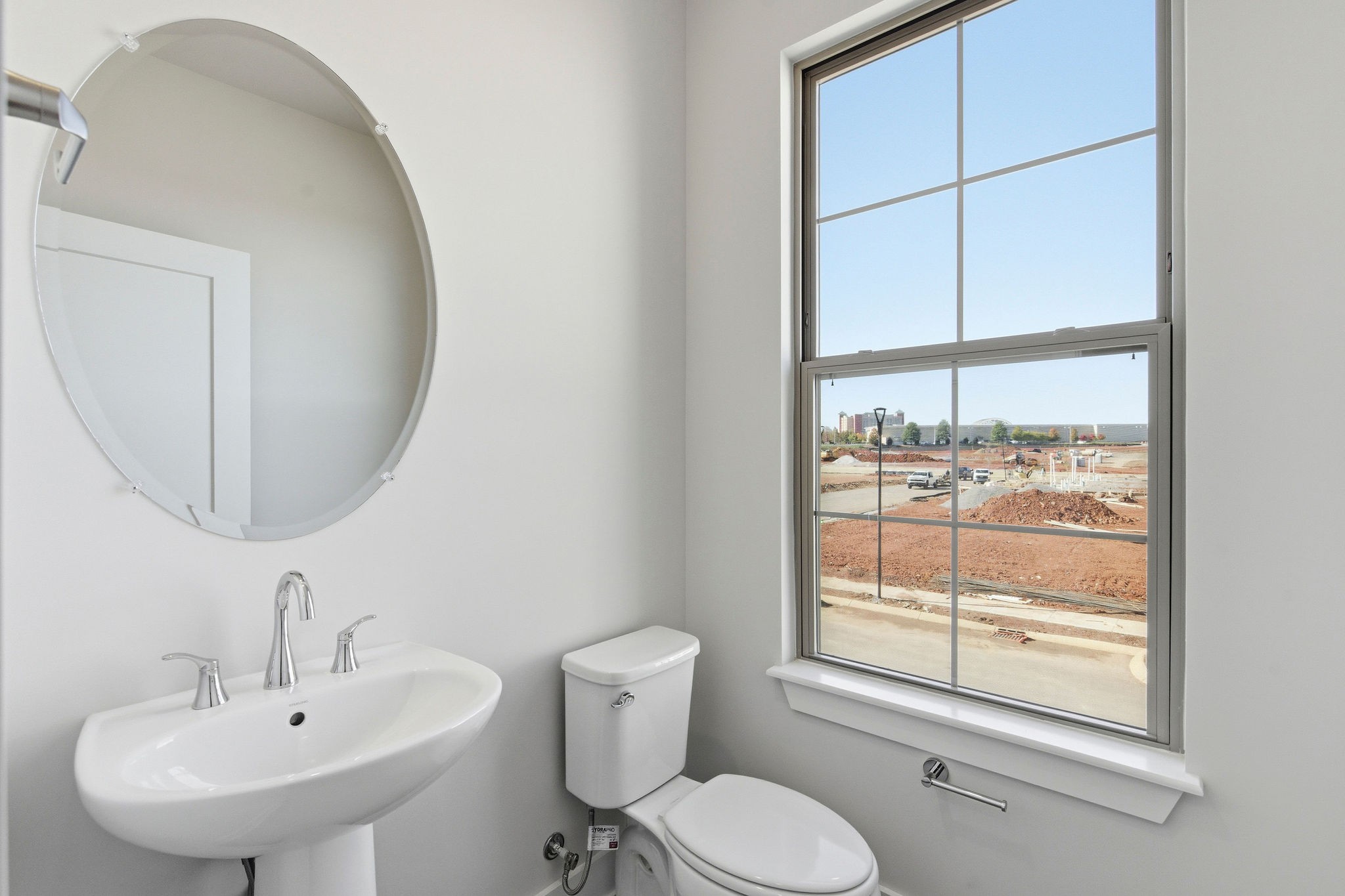 2615 Wilkinson Pike, Unit 1007 Murfreesboro, TN 37129 - Photo 20 of 43 a bathroom with a sink a toilet and a mirror