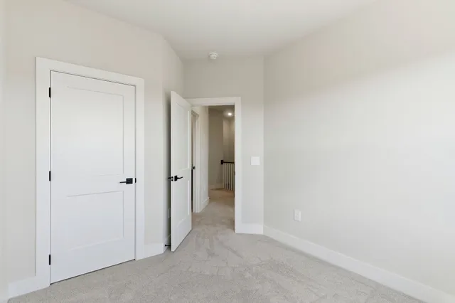 a view of an empty room and closet