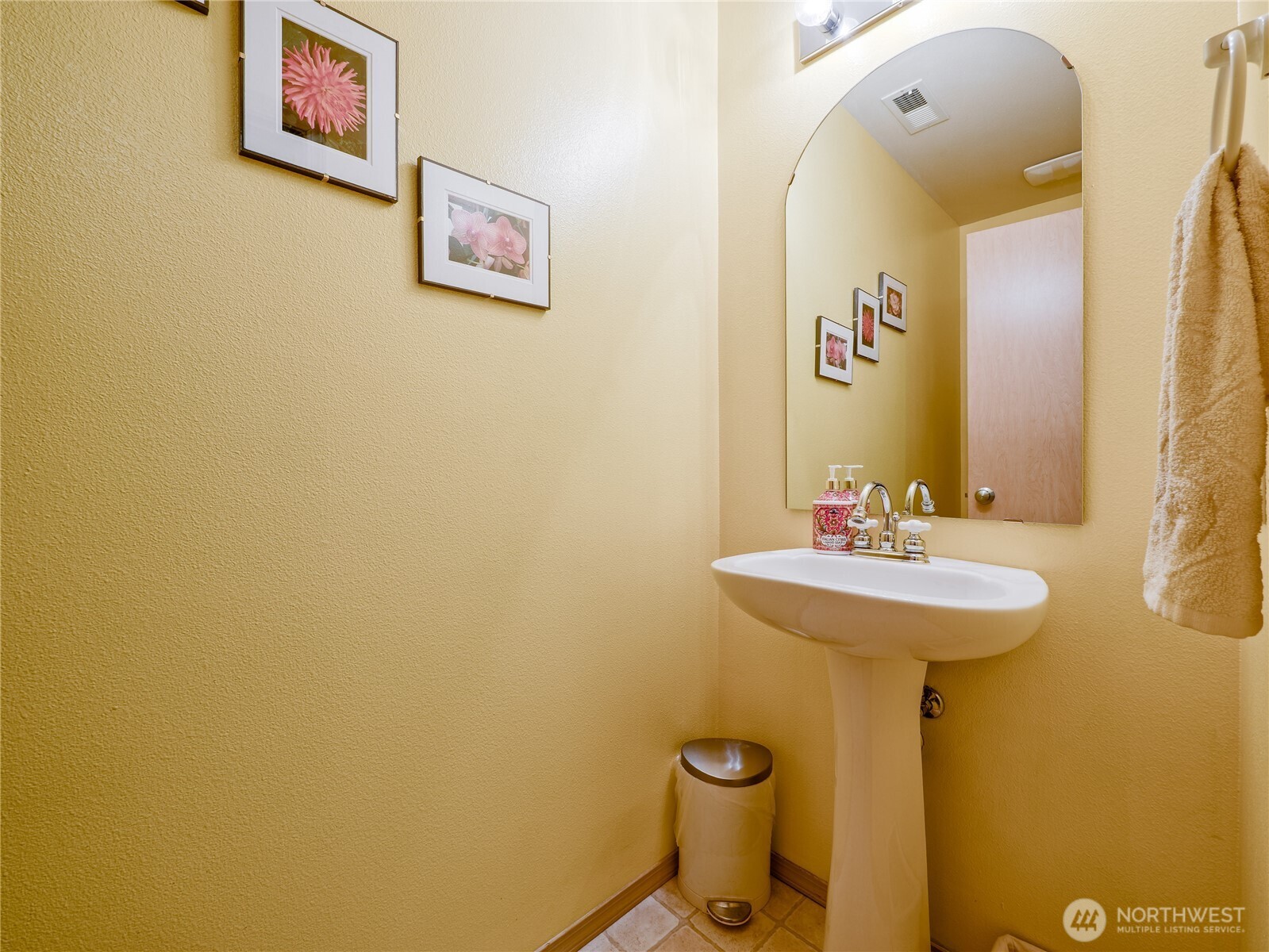 22613 132nd Place Southeast Kent, WA 98042 - Photo 13 of 36 a bathroom with a sink and mirror with toilet