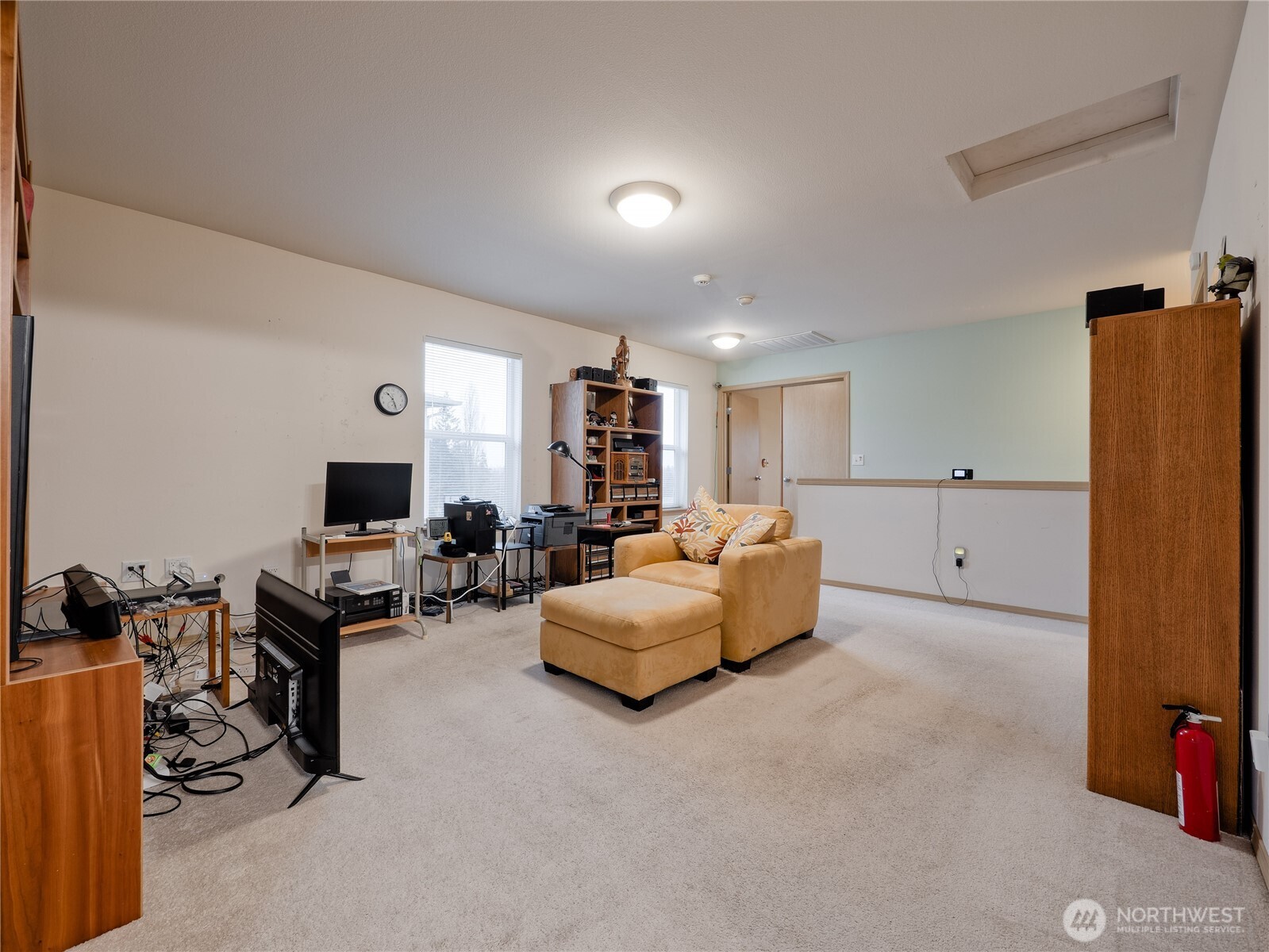 22613 132nd Place Southeast Kent, WA 98042 - Photo 15 of 36 a living room with furniture a flat screen tv and a refrigerator