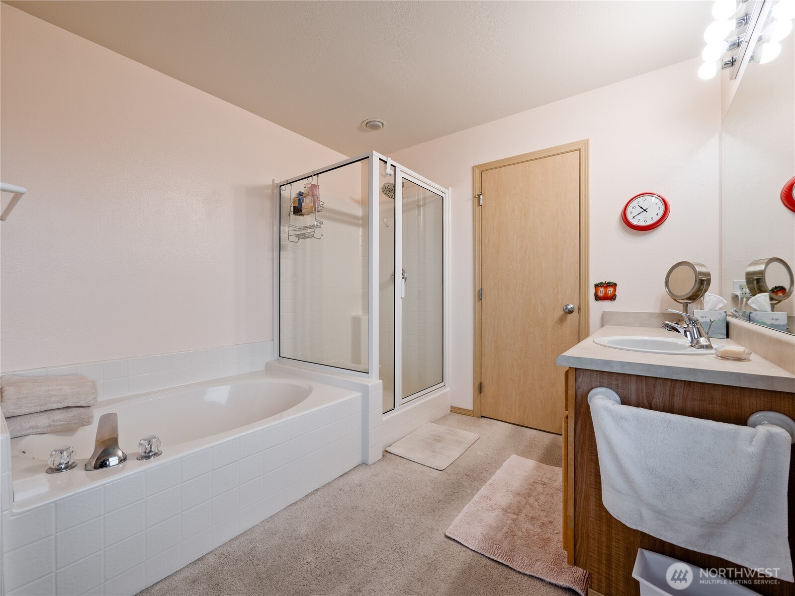 22613 132nd Place Southeast Kent, WA 98042 - Photo 20 of 36 a bathroom with a tub sink and mirror