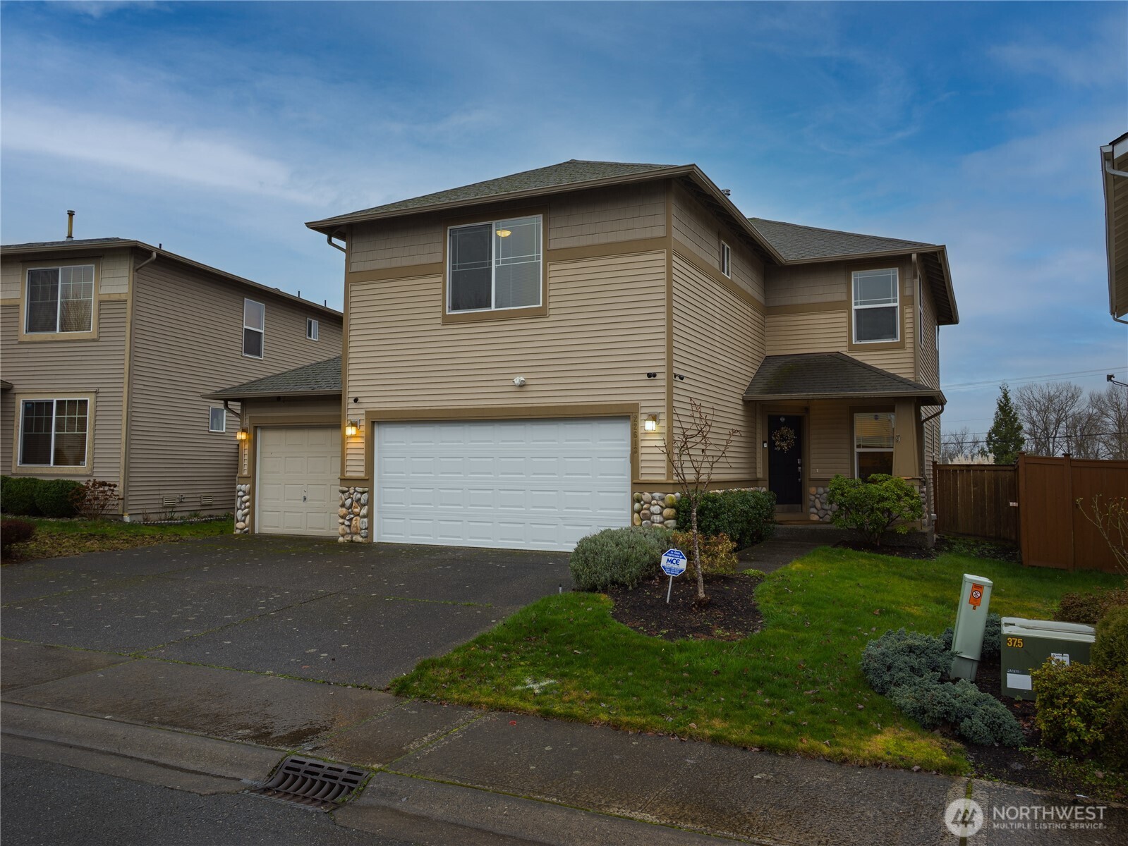 22613 132nd Place Southeast Kent, WA 98042 - Photo 28 of 36 a front view of a house with a garden and yard
