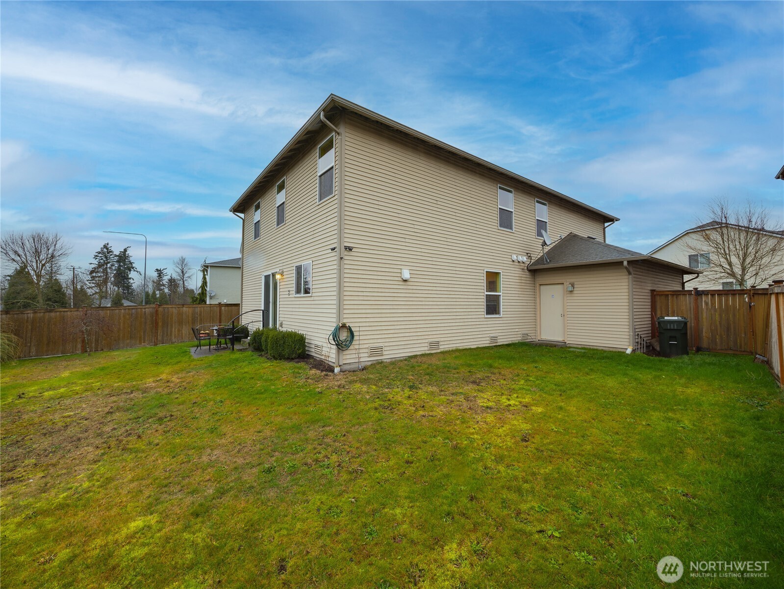 22613 132nd Place Southeast Kent, WA 98042 - Photo 30 of 36 a view of a backyard with plants and a house