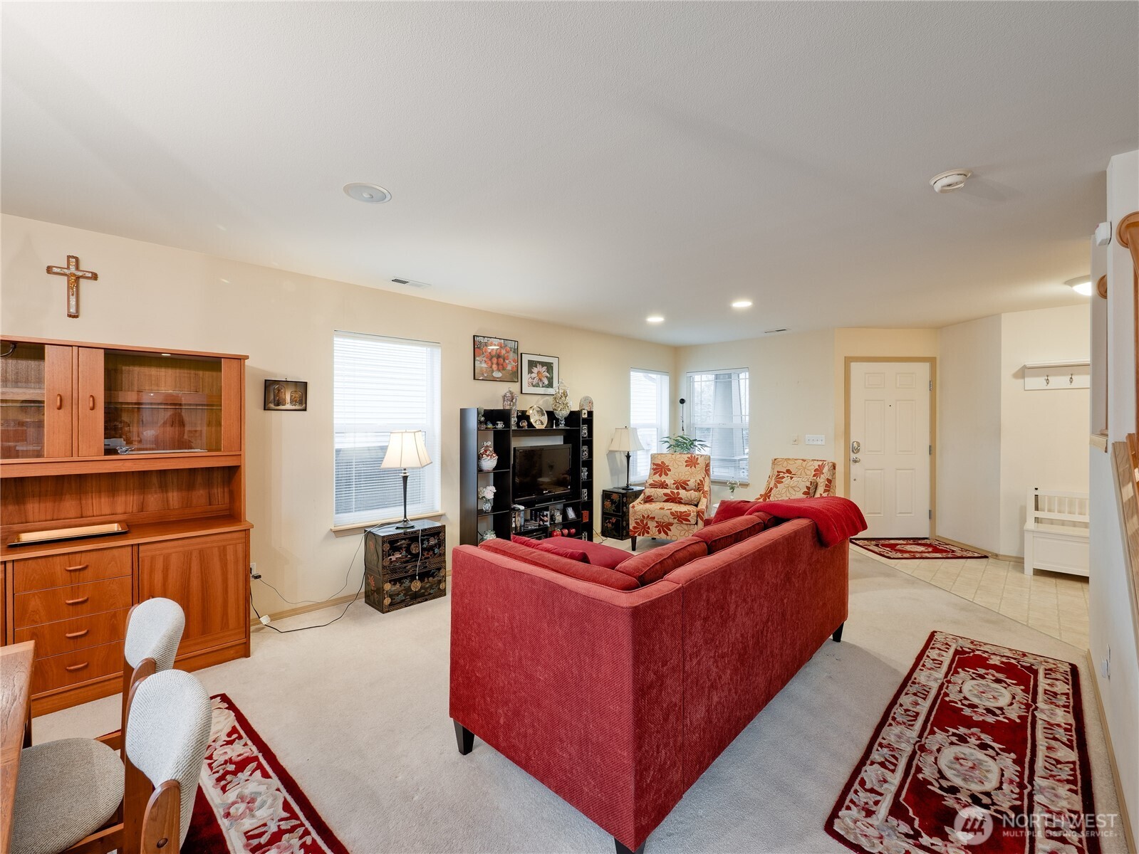22613 132nd Place Southeast Kent, WA 98042 - Photo 5 of 36 a living room with furniture a flat screen tv and kitchen view