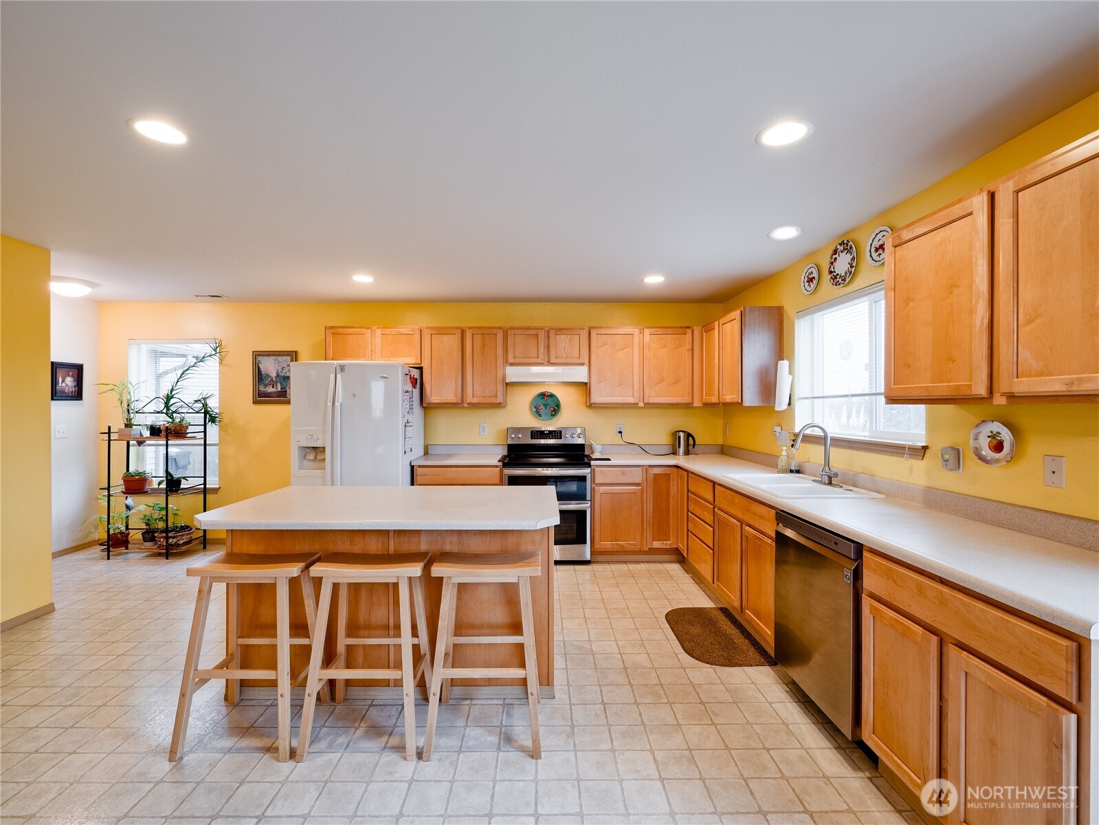 22613 132nd Place Southeast Kent, WA 98042 - Photo 8 of 36 a large kitchen with a table and chairs in it
