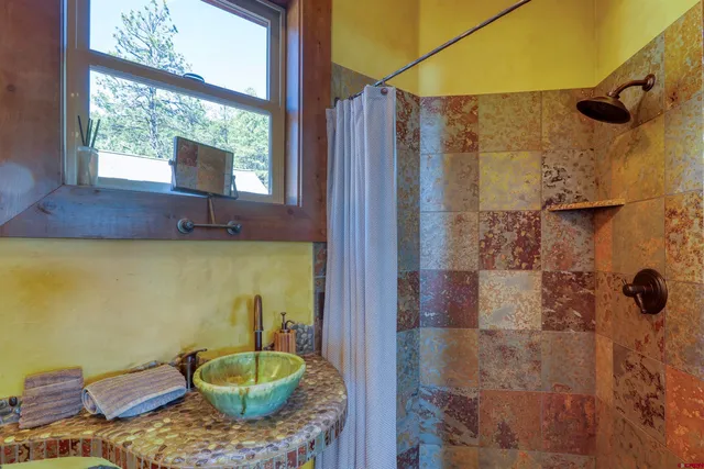 a living room with furniture a lamp and a chandelier