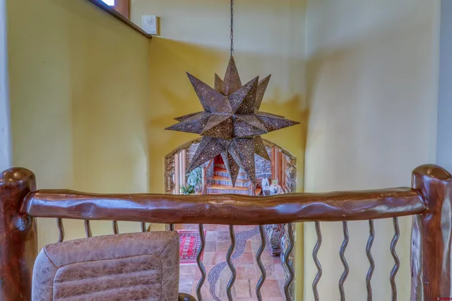 a bathroom with a granite countertop sink a mirror and vanity