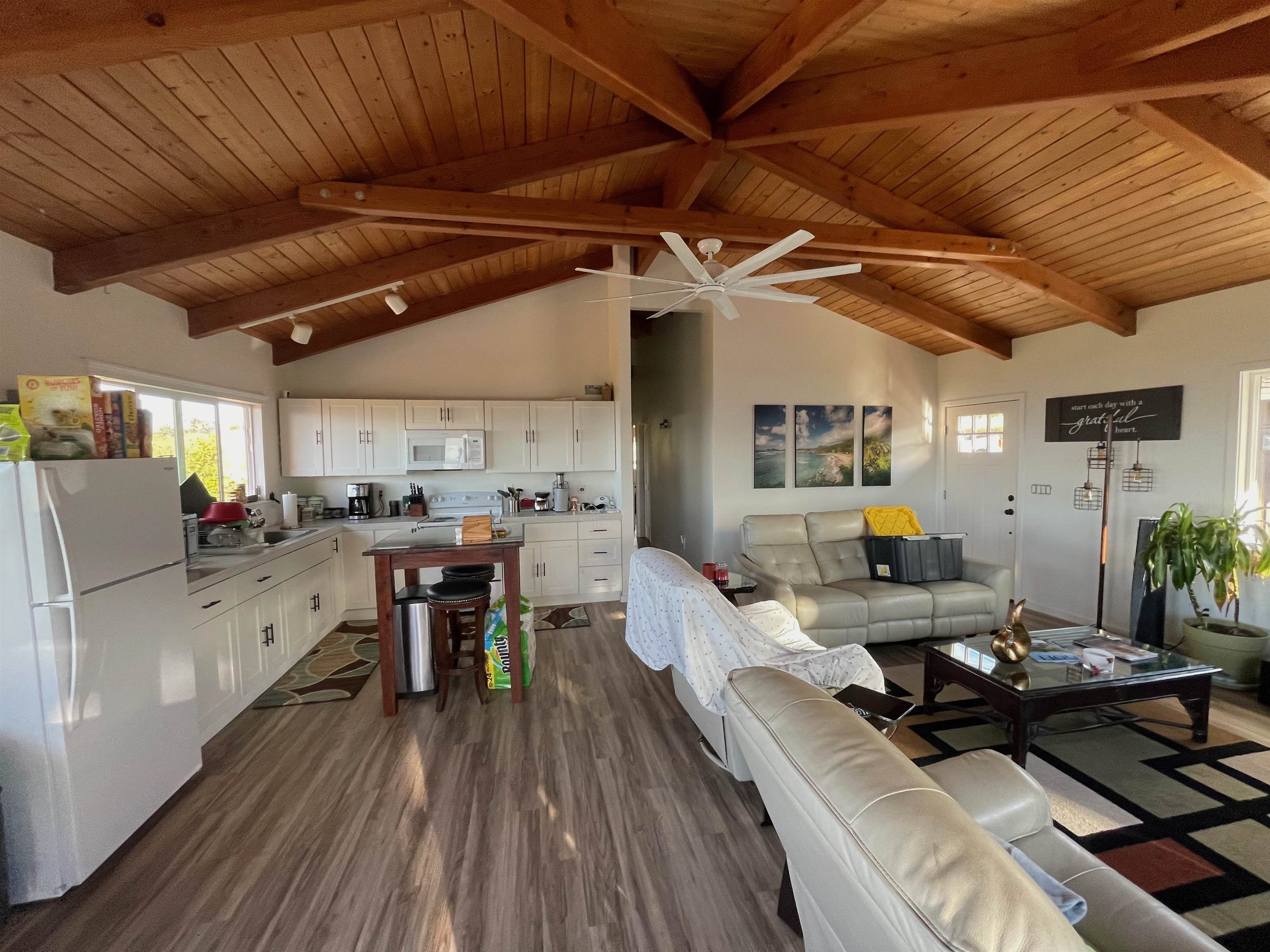 2 Omaopio Road, Unit 2 Kula, HI 96790 - Photo 4 of 8 a living room with lots of furniture and kitchen view