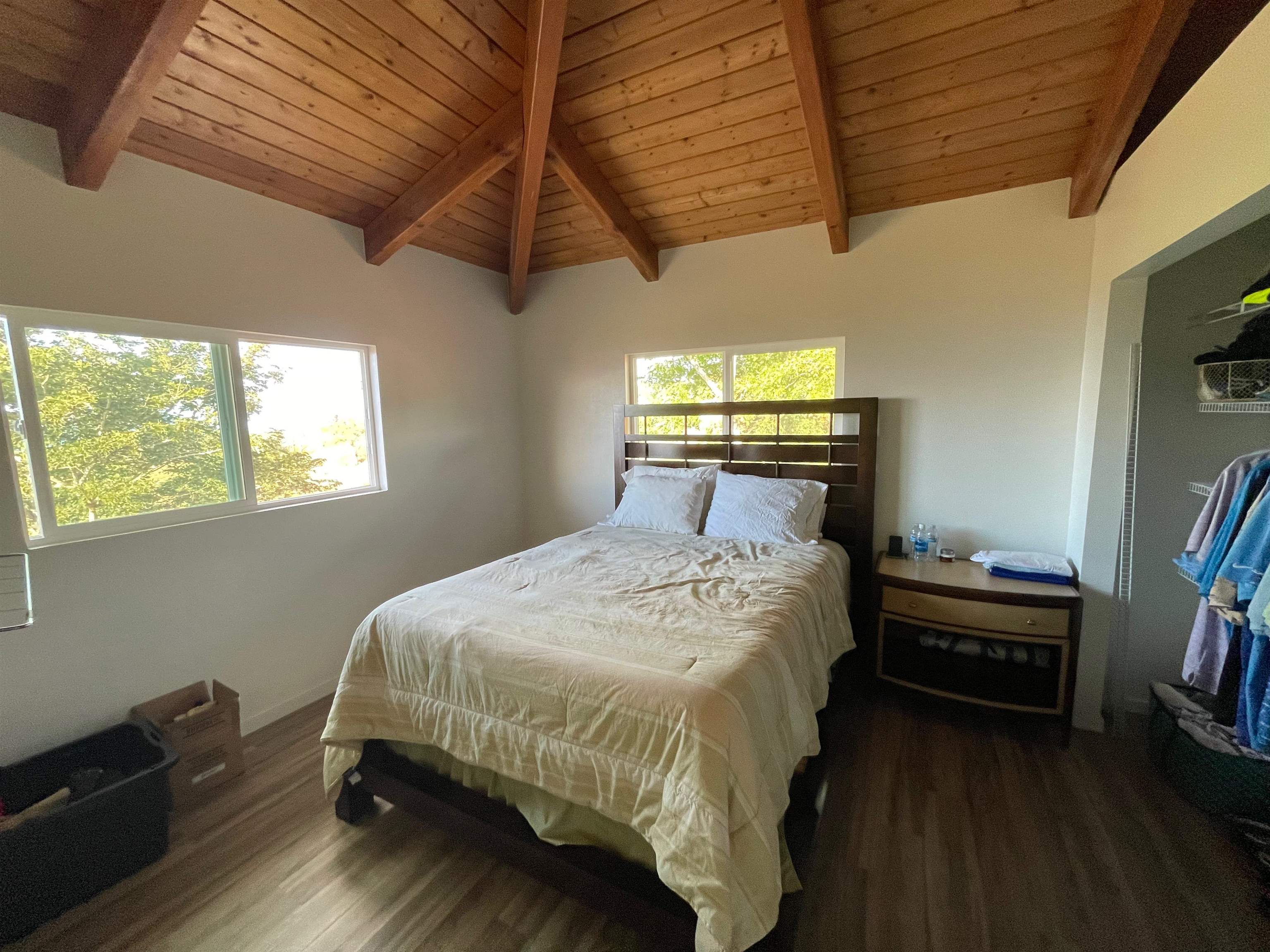 2 Omaopio Road, Unit 2 Kula, HI 96790 - Photo 6 of 8 a bed sitting in a bedroom next to a window