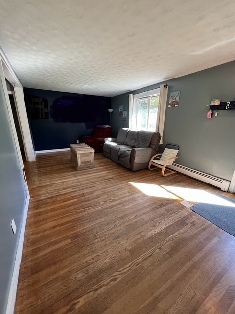 3 Delaney Avenue Dudley, MA 01571 - Photo 4 of 14 a view of a room with furniture and windows