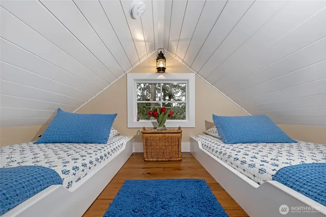 a living room with a couch and a rug