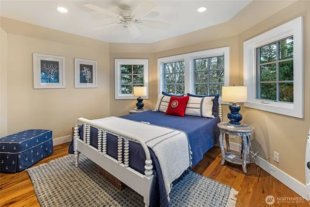 a bedroom with a large bed and a window