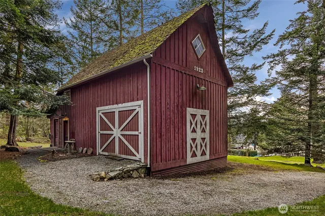 a backyard of a house with barbeque oven