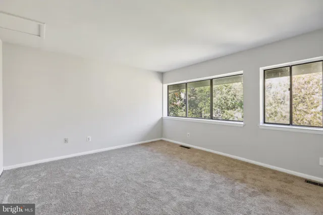 an empty room with windows