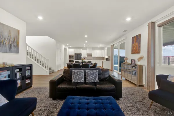 a living room with furniture rug and couch