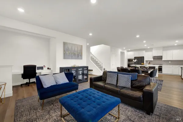 an open kitchen with dining table and chairs