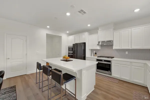 a bedroom with a bed and wall painting