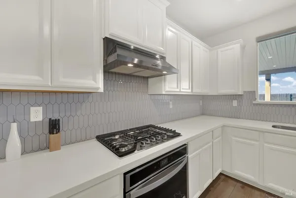 a bedroom with a bed and a wall painting