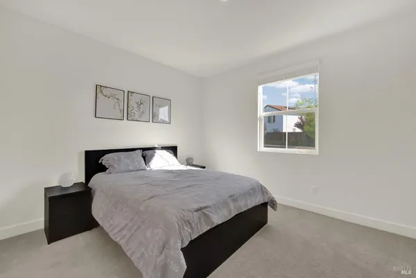 a bathroom with a sink mirror and toilet