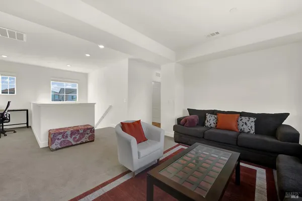 a bedroom with a bed and a cabinets