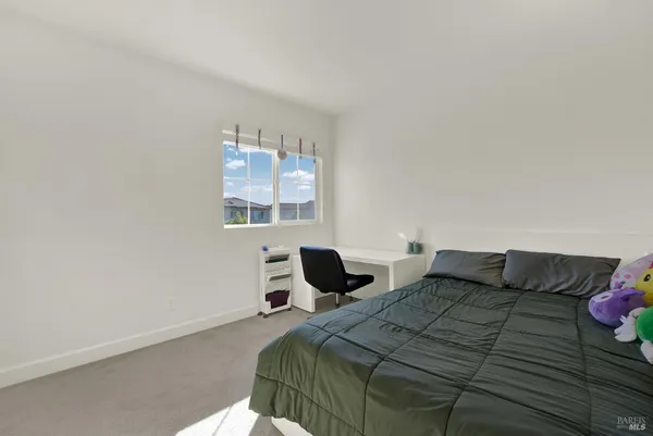 a view of a house with backyard sitting area and garden