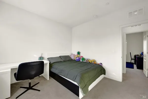 a view of a house with a backyard and a patio