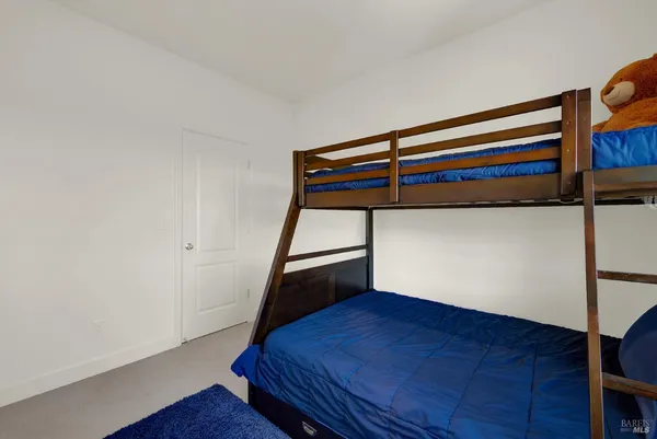 a dinning table and chairs in a patio of the house