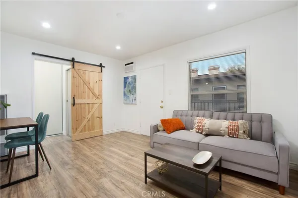 a kitchen with stainless steel appliances a stove a refrigerator and a cabinets