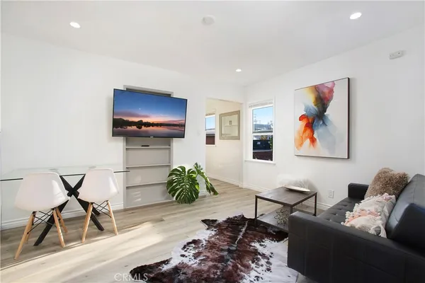 a kitchen with stainless steel appliances a stove a sink and a refrigerator