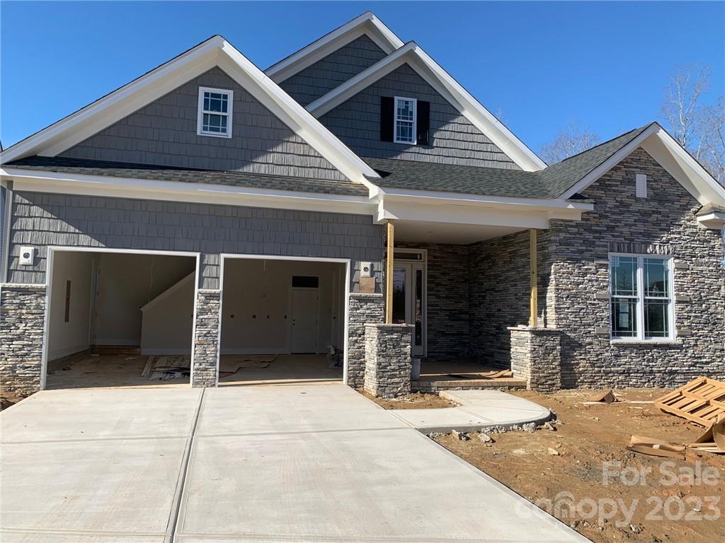 12908 Bailey Road, Unit 193 Cornelius, NC 28031 - Photo 1 of 17 a front view of a house with a garage