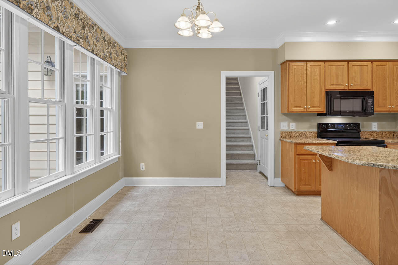 2209 Lodestar Drive Raleigh, NC 27615 - Photo 9 of 50 a view of a kitchen with a sink and dishwasher open kitchen view
