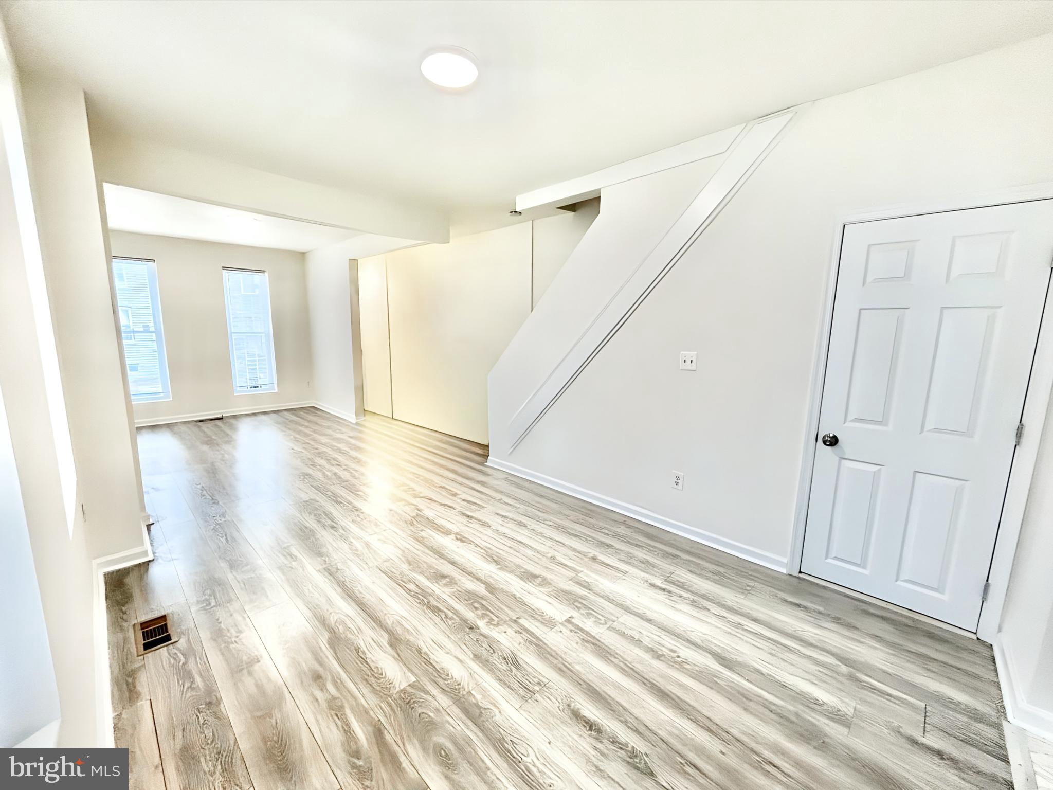 2000 McHenry Street Baltimore, MD 21223 - Photo 1 of 20 a view of an empty room with wooden floor and a window