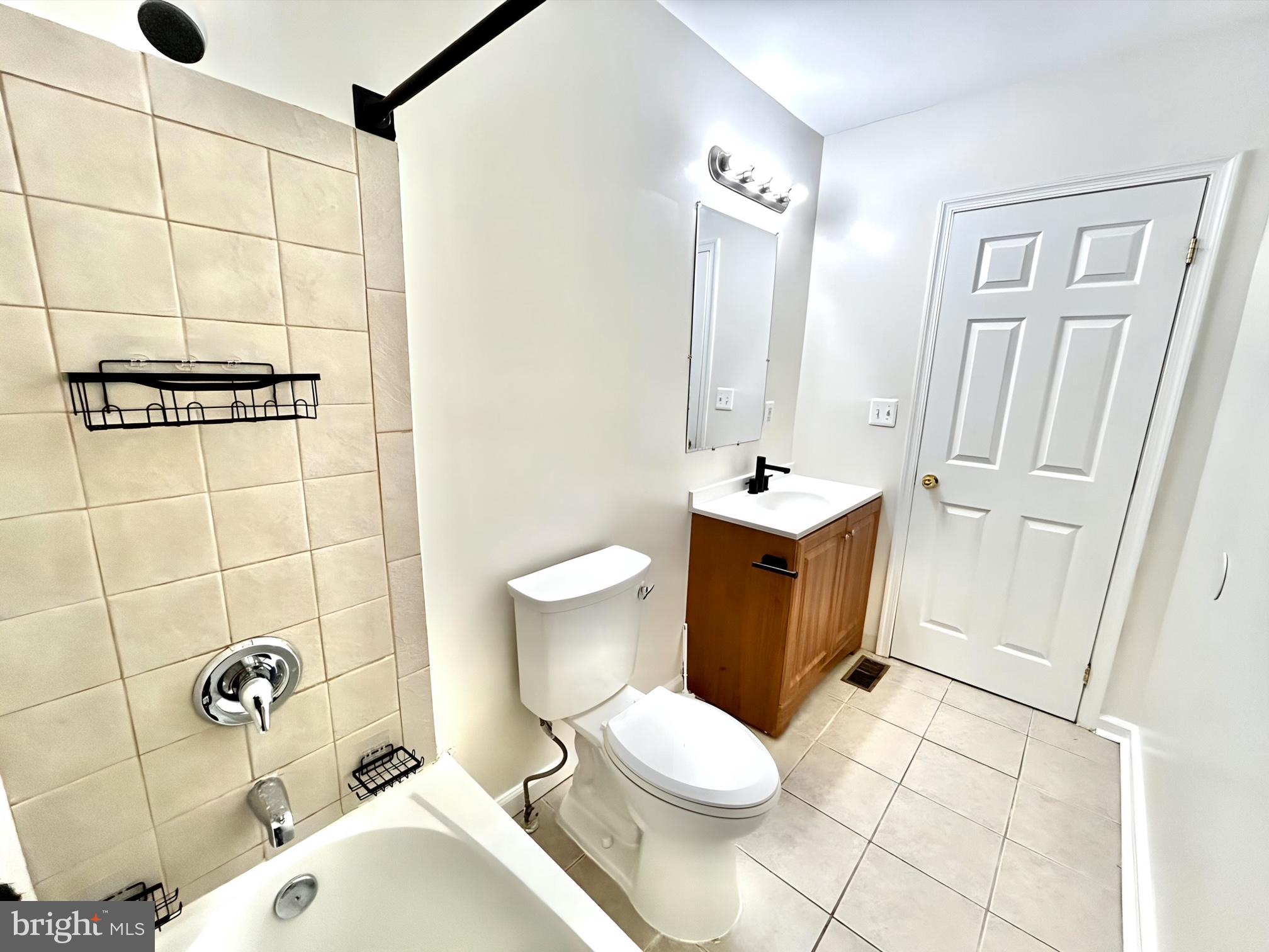 2000 McHenry Street Baltimore, MD 21223 - Photo 15 of 20 a bathroom with a sink toilet and shower