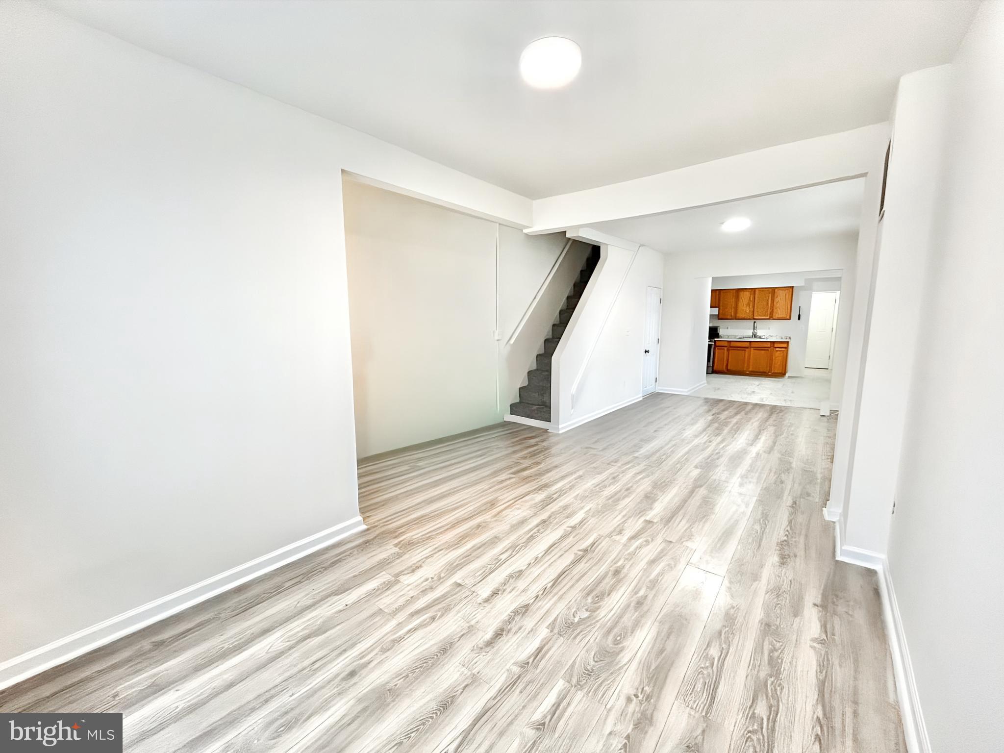2000 McHenry Street Baltimore, MD 21223 - Photo 7 of 20 a view of a room with wooden floor and window