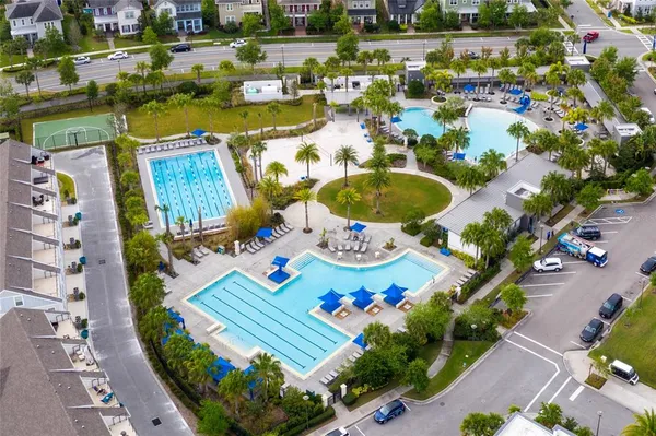 a swimming pool with outdoor space and seating area