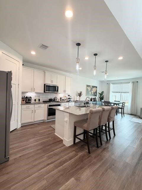 13725 Rising Sun Lane Conroe, TX 77384 - Photo 8 of 29 a large white kitchen with lots of counter space a sink appliances and cabinets