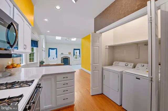 a bathroom with a sink mirror and toilet