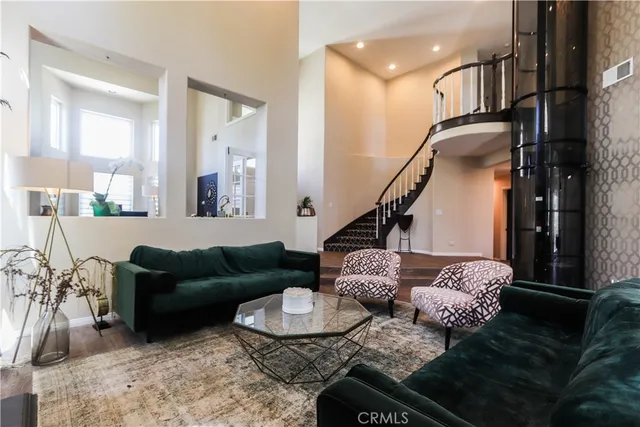 a living room with furniture or couch and a ceiling fan