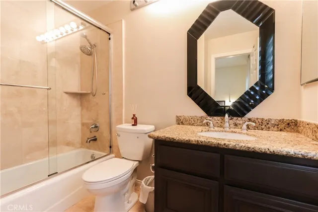 a view of a hallway with furniture and a living room
