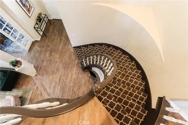 a living room with furniture a fireplace and a large window