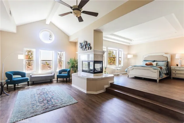 a large bathroom with a large tub and sink