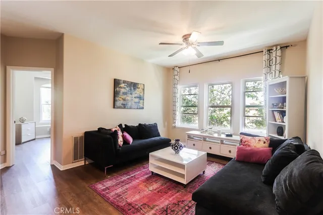 a bathroom with a granite countertop sink mirror and a shower