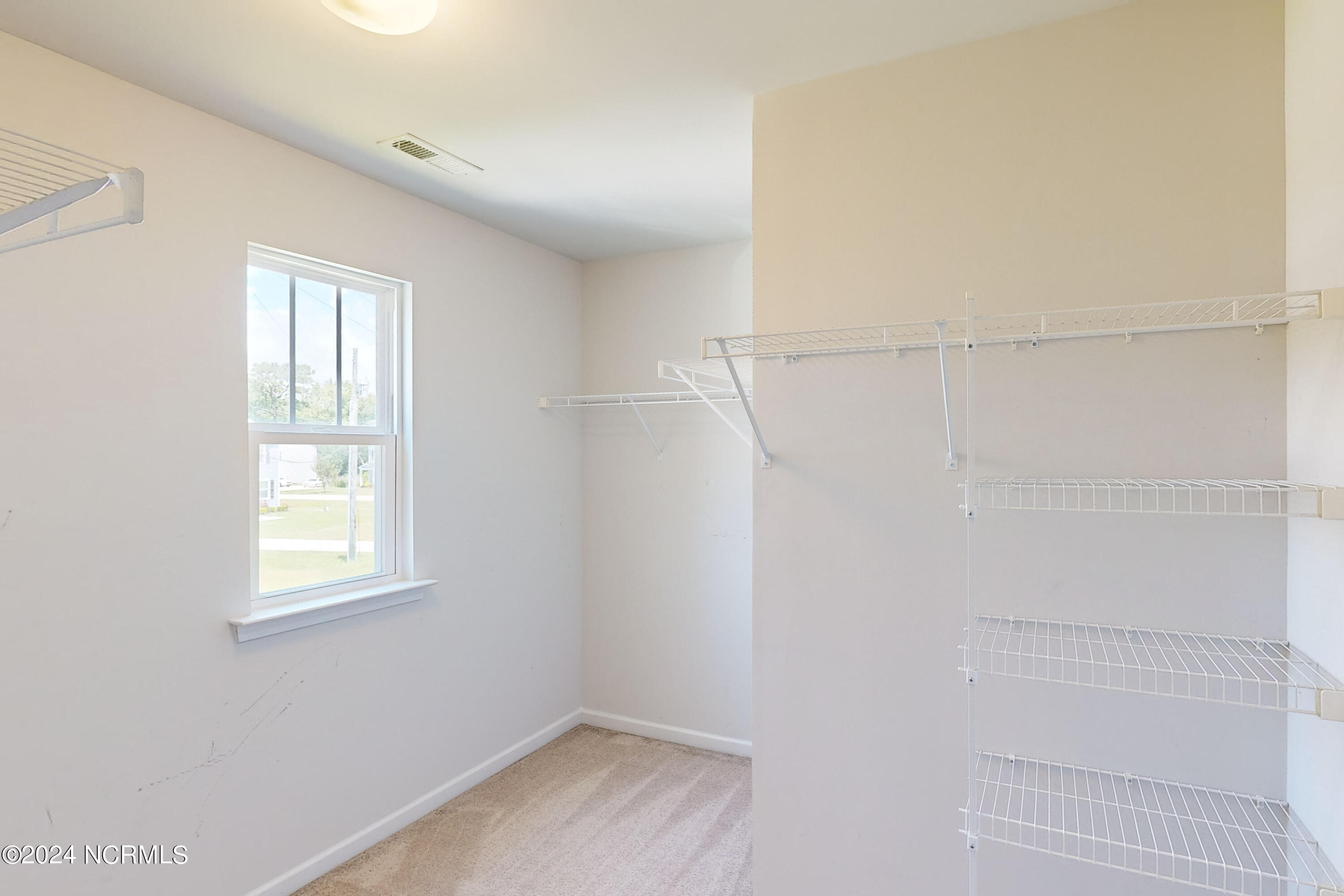 405 Saxby Way Holly Ridge, NC 28445 - Photo 46 of 54 Walk In Closet - Primary Bedroom