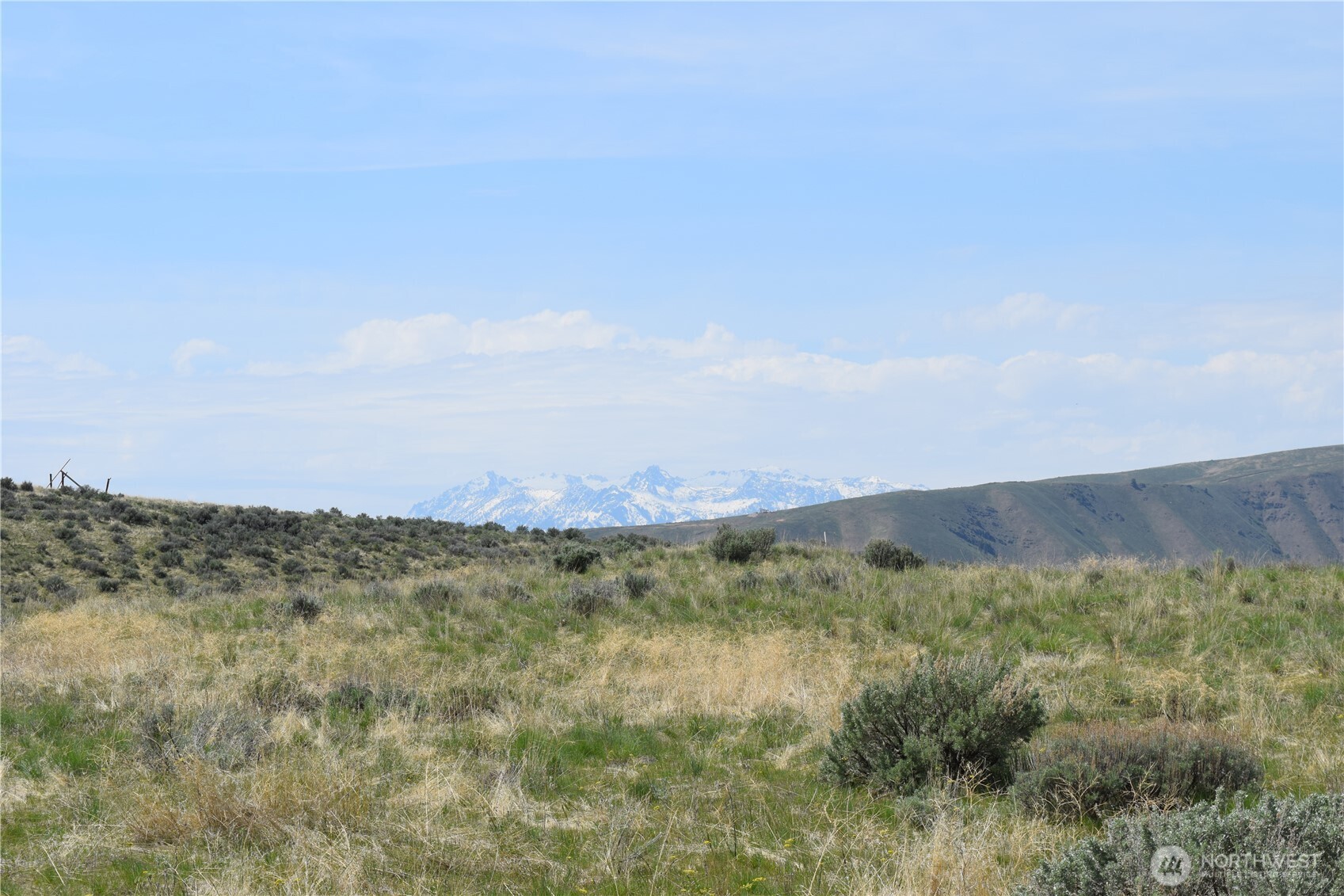 8 Blue Grade Road East Wenatchee, WA 98802 - Photo 7 of 11 a view of a field with an ocean and trees