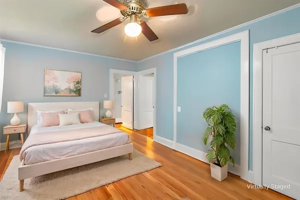 a bedroom with furniture and a window